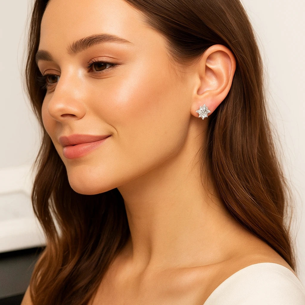 Close-up of a woman wearing a Flower -shaped earring with a neutral background