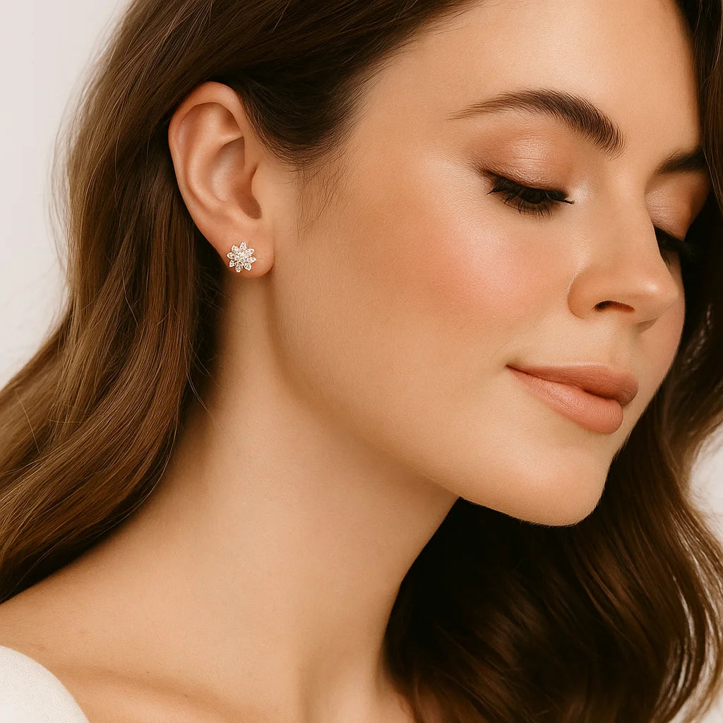 Close-up of a woman wearing a floral earring with a soft background
