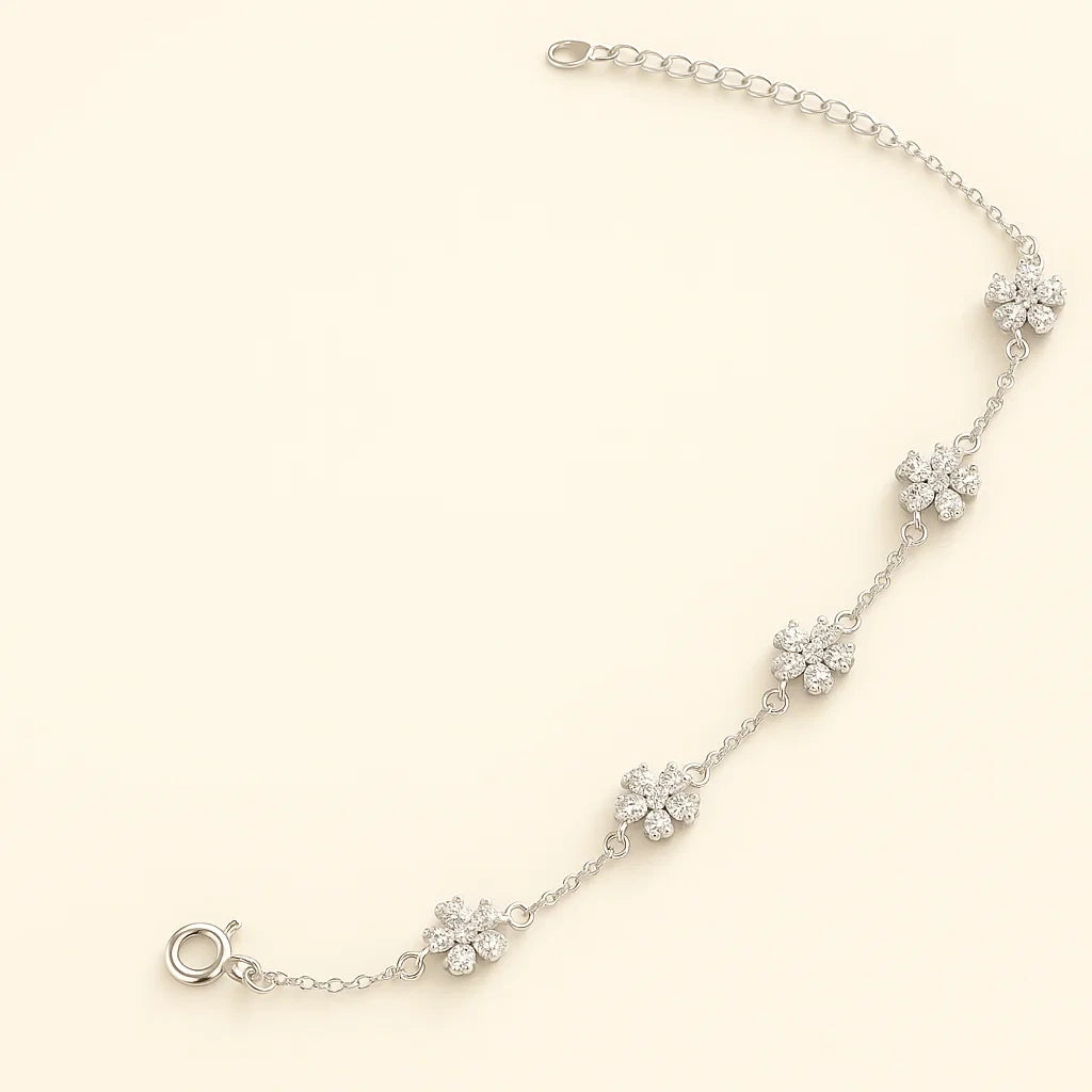 Three color variations of a 925 sterling silver flower chain bracelet: silver with clear stones, gold-plated with green stones, and gold-plated with pink stones.