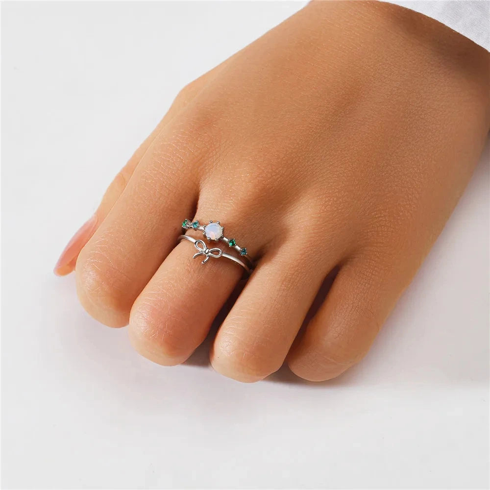 925 silver ring with butterfly and synthetic opal stone detail on white background