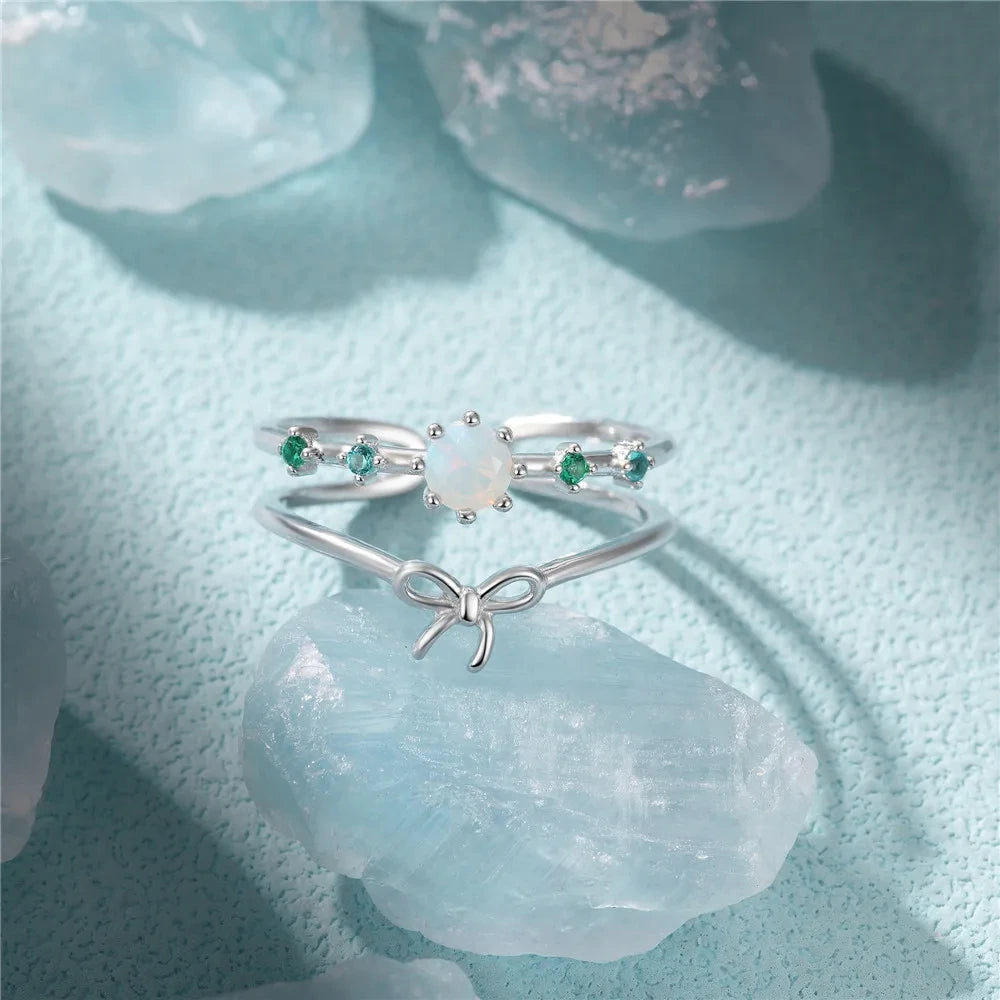 925 silver ring with butterfly and synthetic opal stone detail on white background