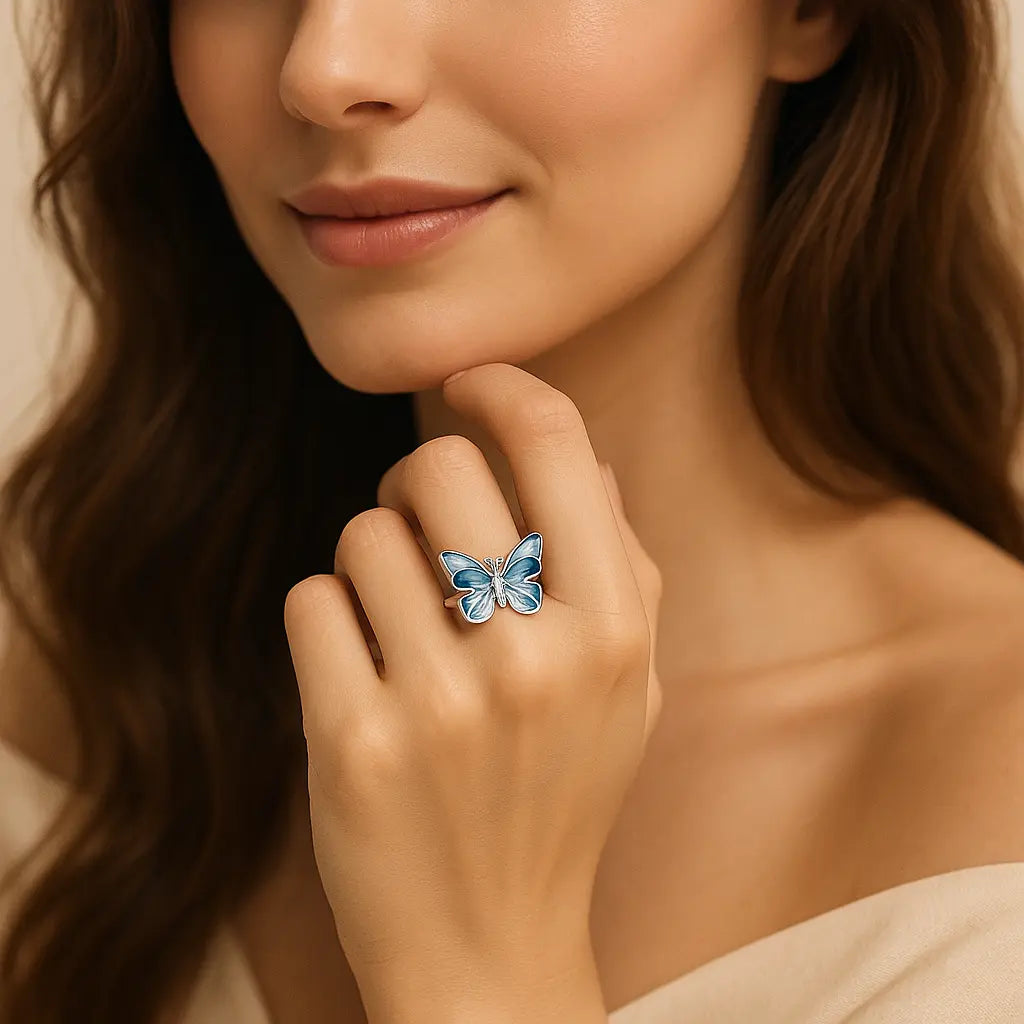 Elegant 925 silver ring featuring a blue butterfly with enamel wings and sparkling stone accents