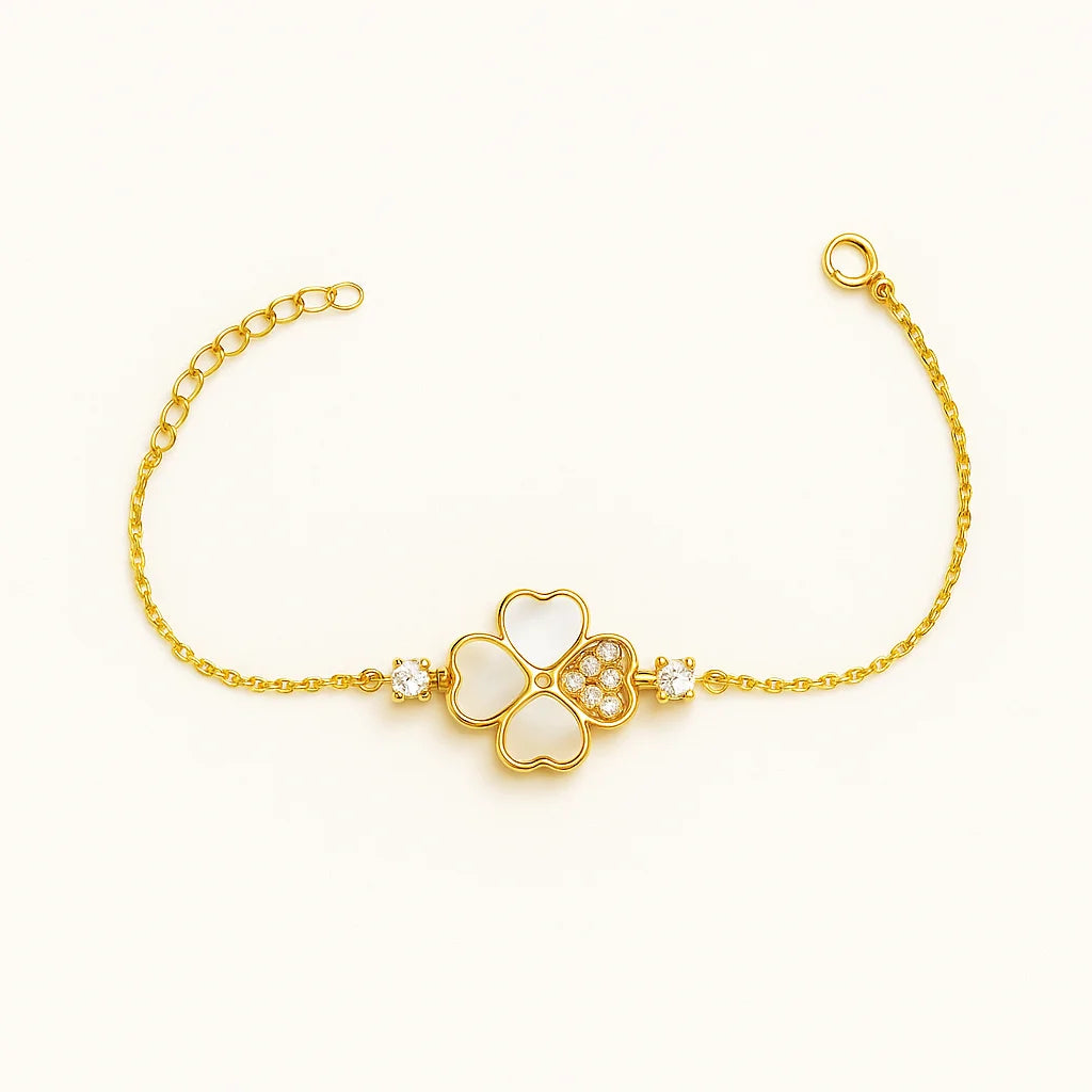 A beautiful sterling silver bracelet with a four-leaf clover charm featuring mother-of-pearl and cubic zirconia details.