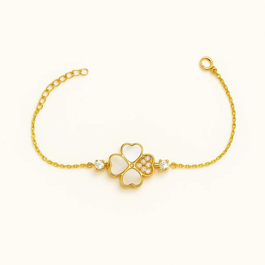 A beautiful sterling silver bracelet with a four-leaf clover charm featuring mother-of-pearl and cubic zirconia details.