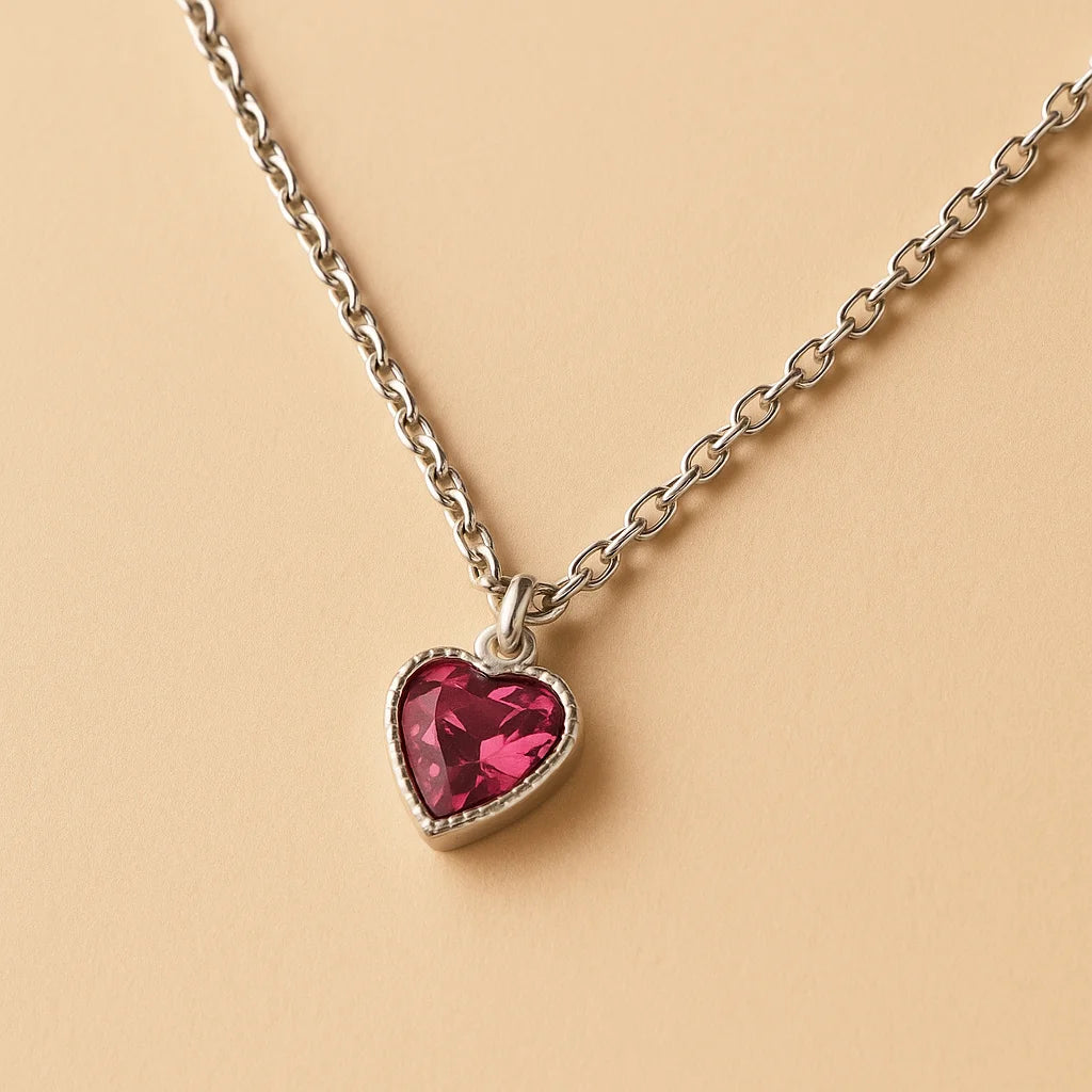A 925 sterling silver and a gold-plated necklace, each with a heart-shaped stone pendant in pink or magenta.