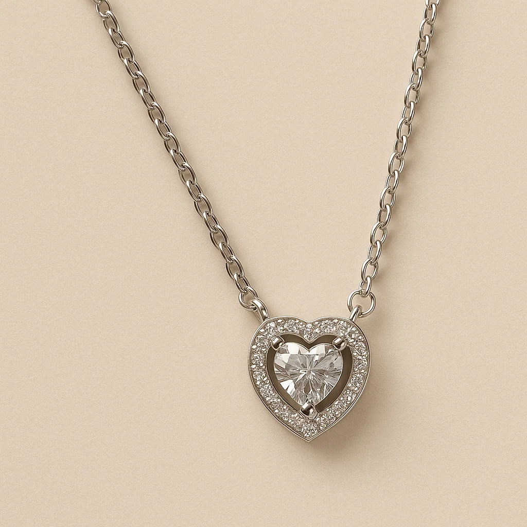 A 925 sterling silver and a gold-plated necklace, each with a heart-shaped stone and a sparkling pavé halo.