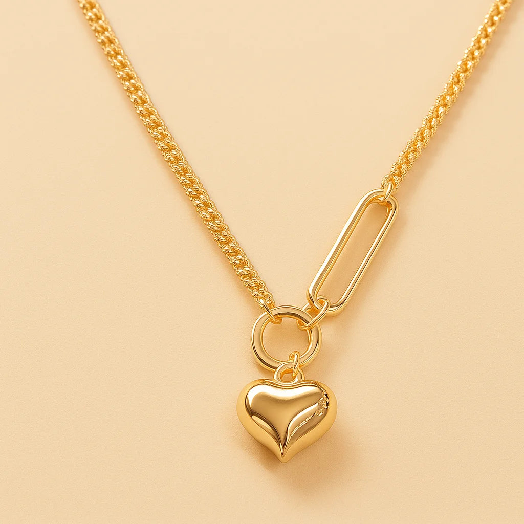 A 925 sterling silver and a gold-plated necklace, each with a smooth, polished heart-shaped pendant on a modern mixed-link chain.