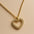 A 925 sterling silver and a gold-plated necklace, each with a heart-shaped pendant completely paved in sparkling cubic zirconia.