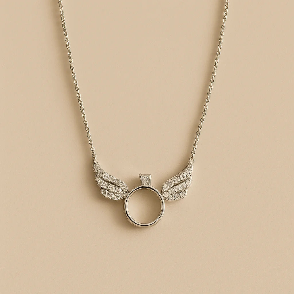 A beautiful sterling silver necklace with a winged ring pendant adorned with sparkling cubic zirconia stones.

