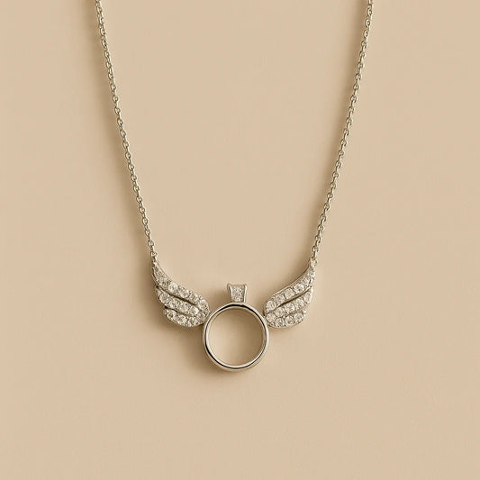 A beautiful sterling silver necklace with a winged ring pendant adorned with sparkling cubic zirconia stones.

