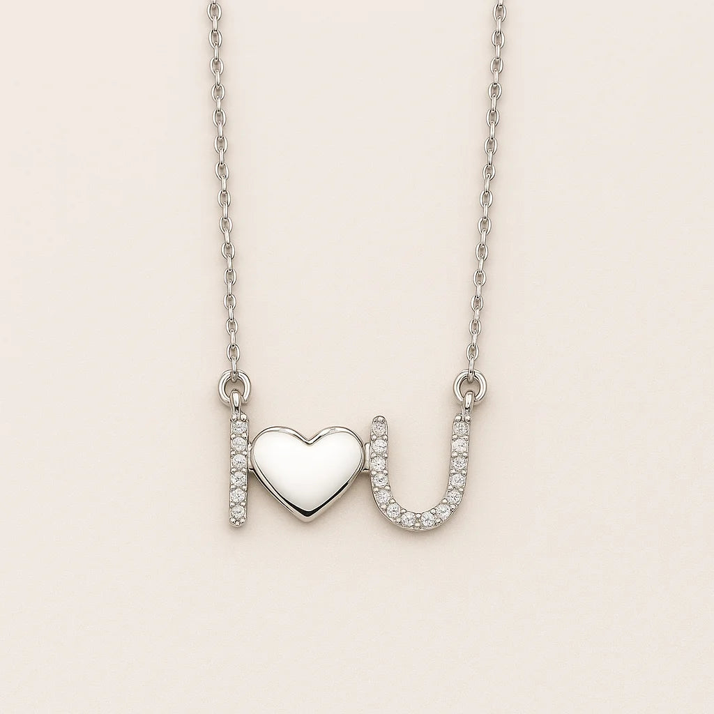 A beautiful sterling silver necklace with an "I love U" pendant, featuring a polished heart and sparkling cubic zirconia stones.