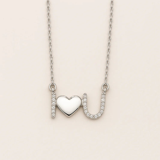 A beautiful sterling silver necklace with an "I love U" pendant, featuring a polished heart and sparkling cubic zirconia stones.