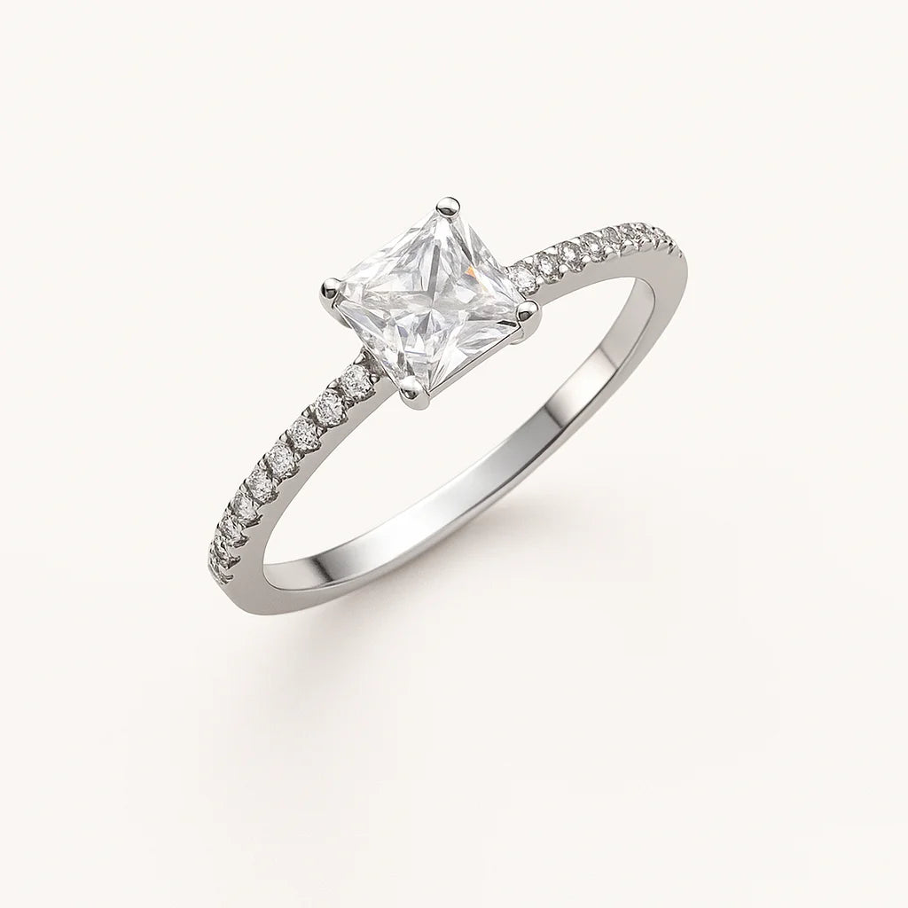 A sparkling princess-cut solitaire 925 sterling silver ring with pavé accents.