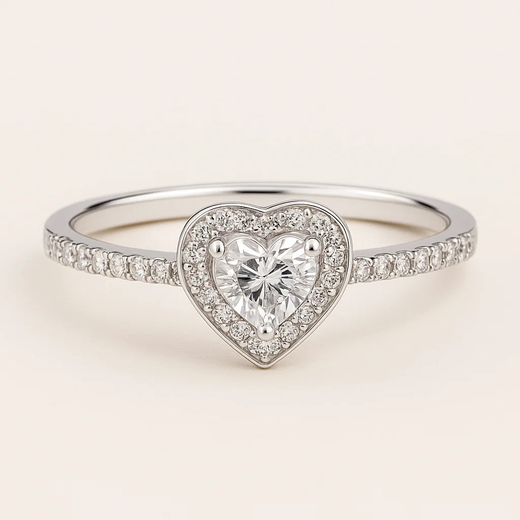 A 925 sterling silver ring with a central heart-shaped cubic zirconia stone (clear or red) and a sparkling pavé halo and band.