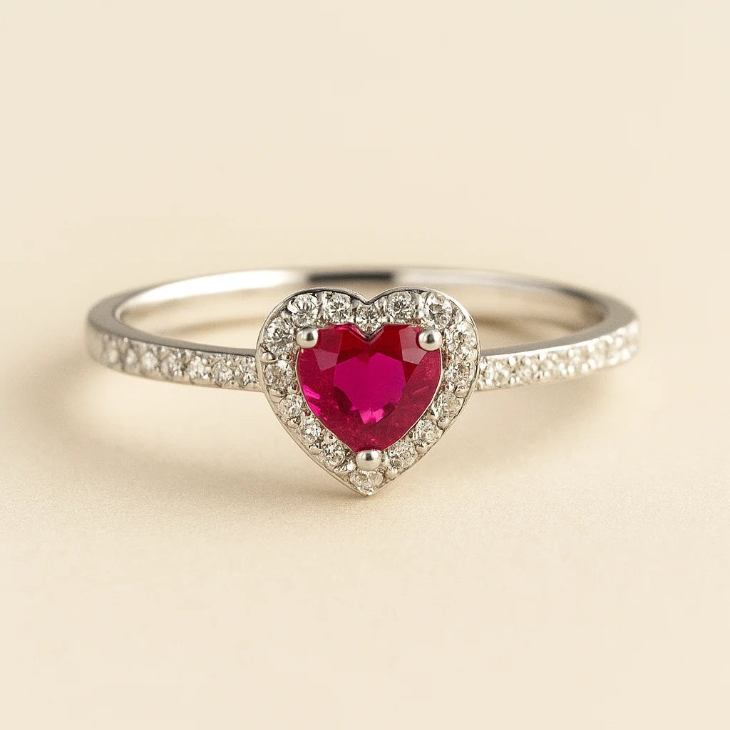 A 925 sterling silver ring with a central heart-shaped cubic zirconia stone (clear or red) and a sparkling pavé halo and band.