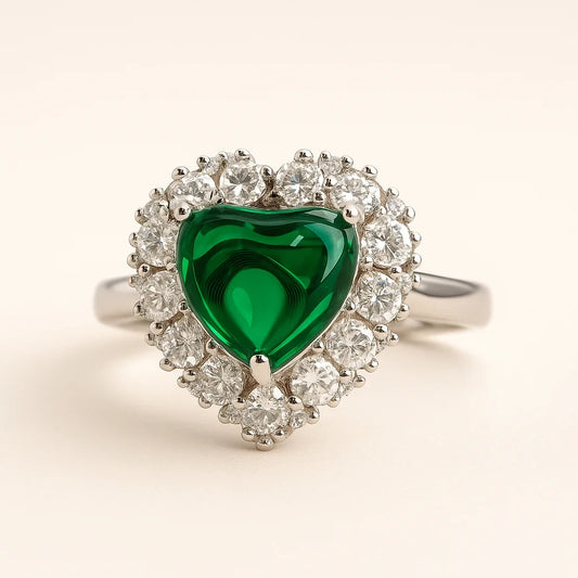 A 925 sterling silver ring with a central green heart-shaped stone and a sparkling halo of clear cubic zirconia.