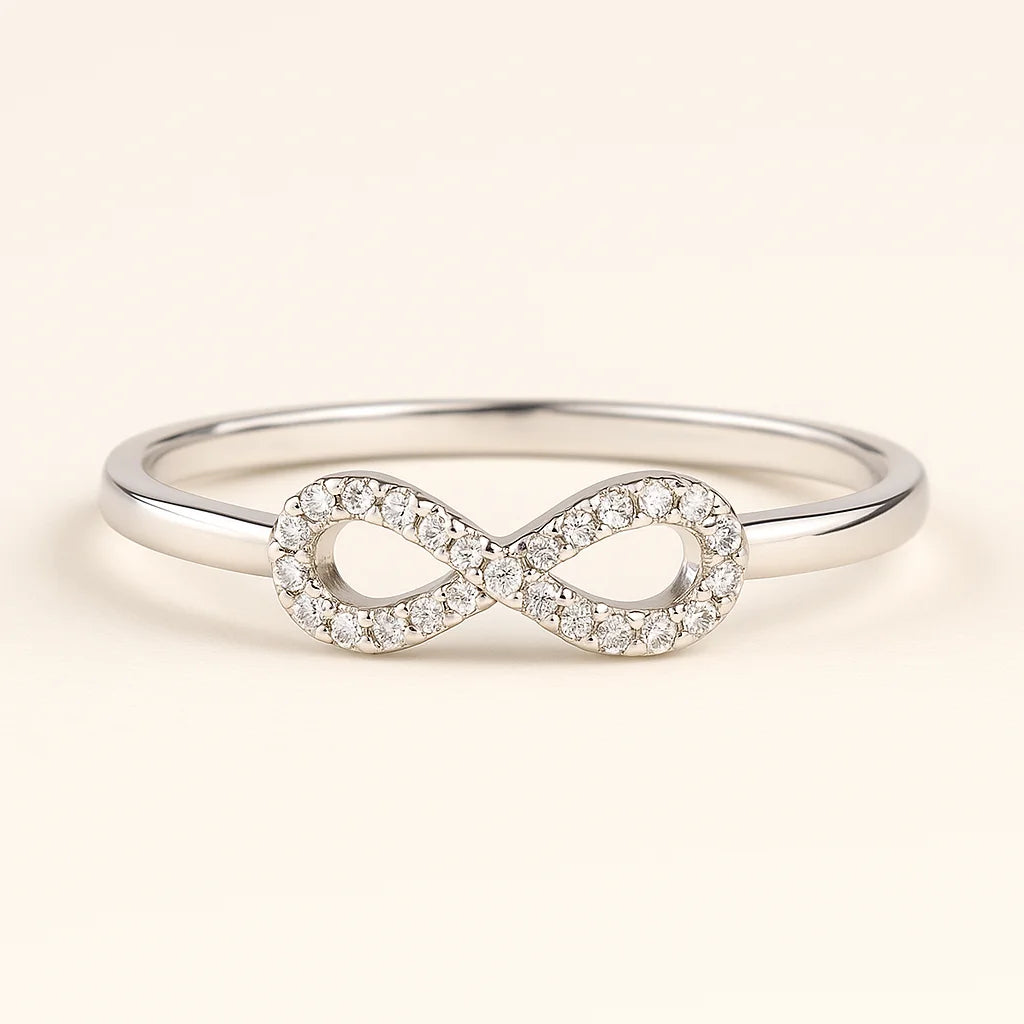 A 925 sterling silver ring with a central infinity symbol paved with sparkling cubic zirconia stones.