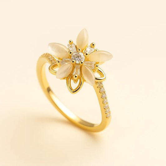 A 925 sterling silver and a gold-plated ring, each with a central lotus flower made of mother-of-pearl and sparkling cubic zirconia.