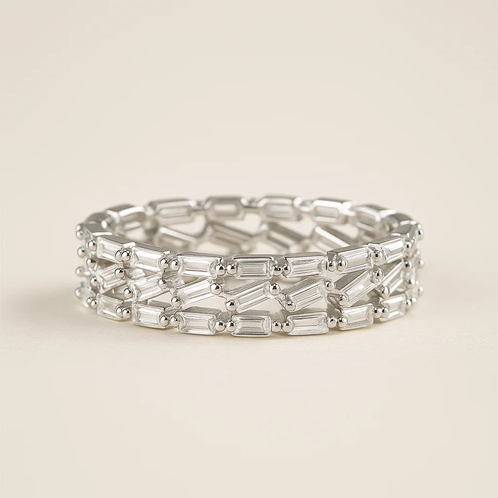 A wide 925 sterling silver ring with three interlocking rows of baguette-cut cubic zirconia stones.