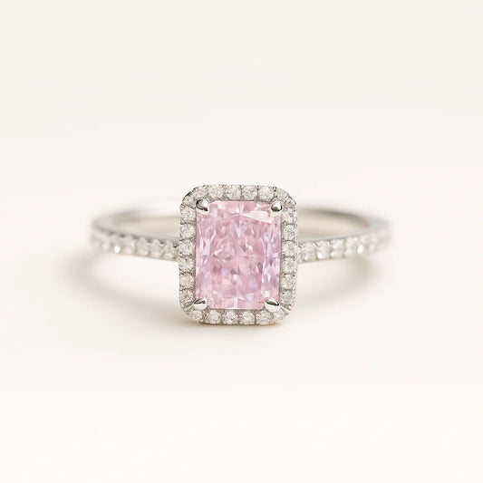 A 925 sterling silver ring with a central pink radiant-cut stone and a halo of sparkling cubic zirconia.