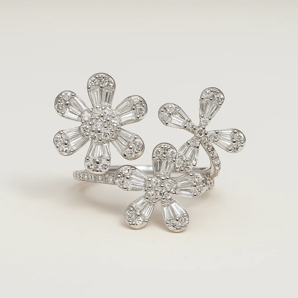 A 925 sterling silver open-wrap ring with three floral clusters made of baguette and pavé cubic zirconia.