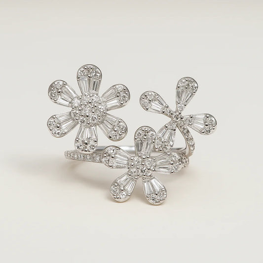 A 925 sterling silver open-wrap ring with three floral clusters made of baguette and pavé cubic zirconia.