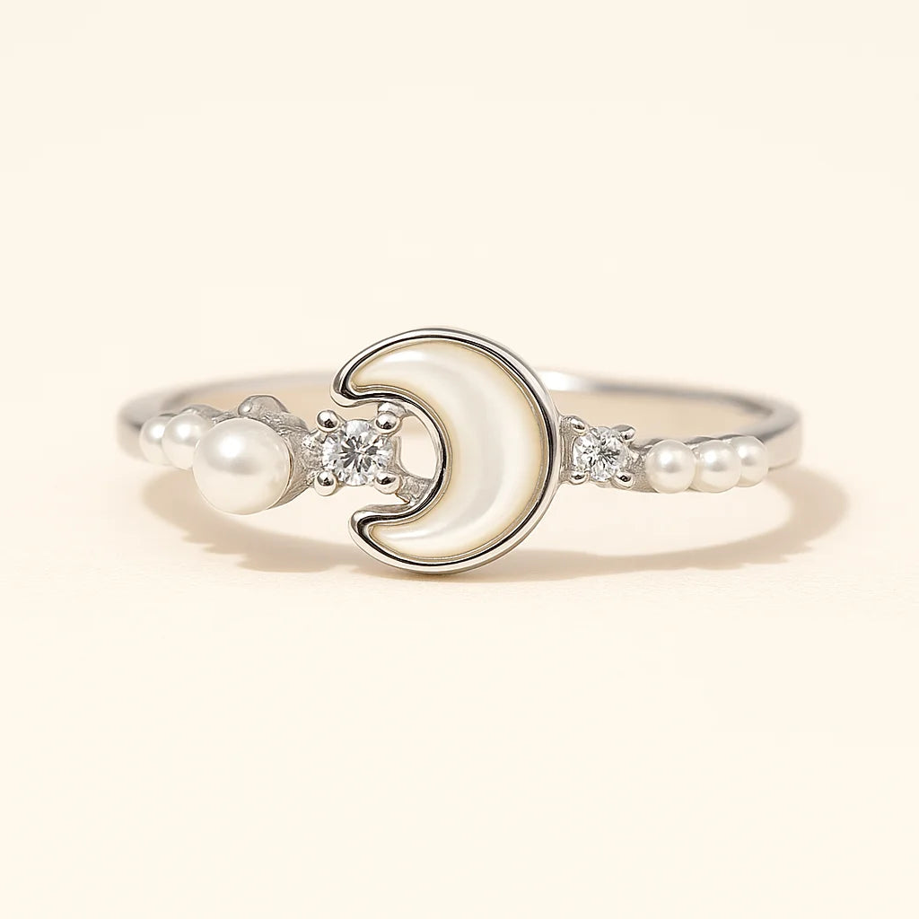A stunning crescent moon gold-plated ring with mother-of-pearl and pearls.