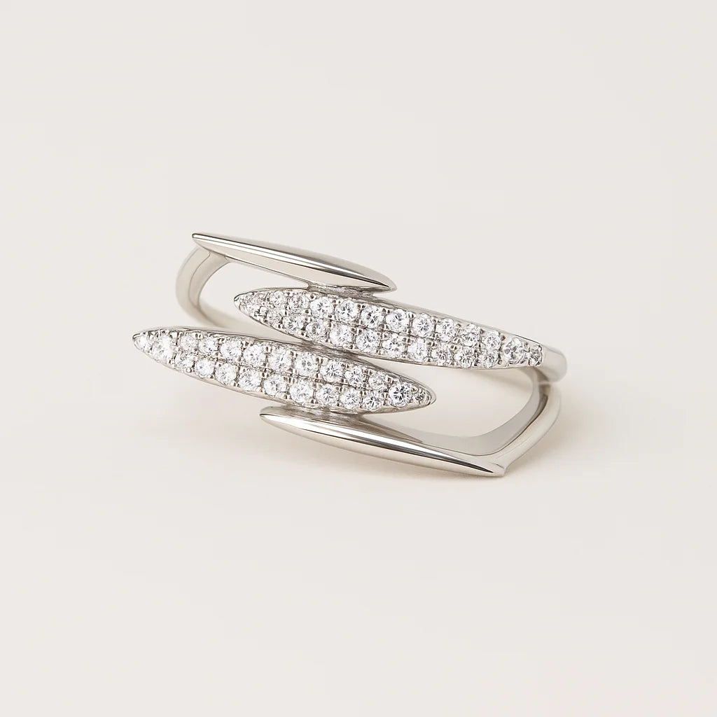 A 925 sterling silver open-band ring with a wrap-around design and two pavé cubic zirconia accents.
