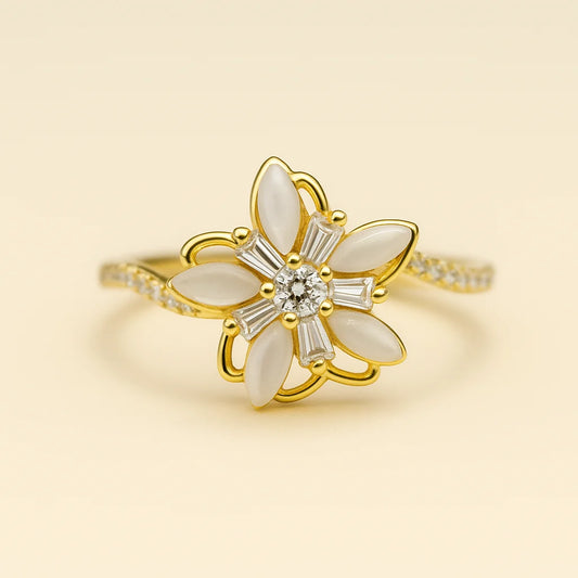 A 925 sterling silver and a gold-plated ring, each with a central flower made of mother-of-pearl, baguette, and pavé cubic zirconia.